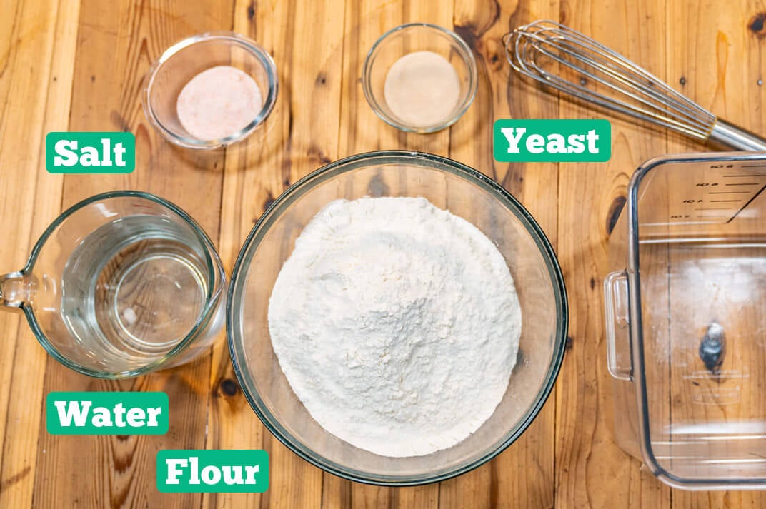 No-knead artisan bread ingredients: yeast, flour, salt, and water.
