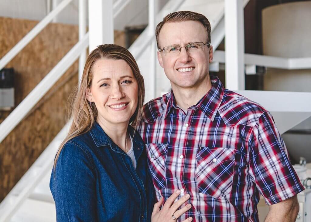 A man and wife posing for a photo.