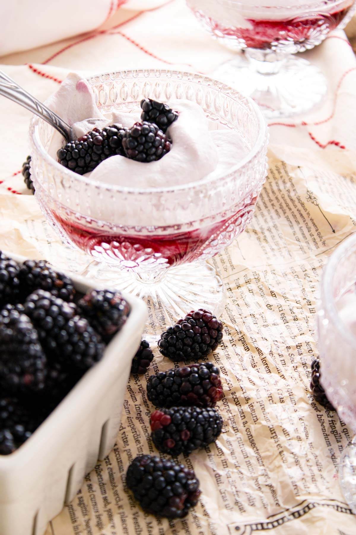 served in stemware and garnished with fresh blackberries.