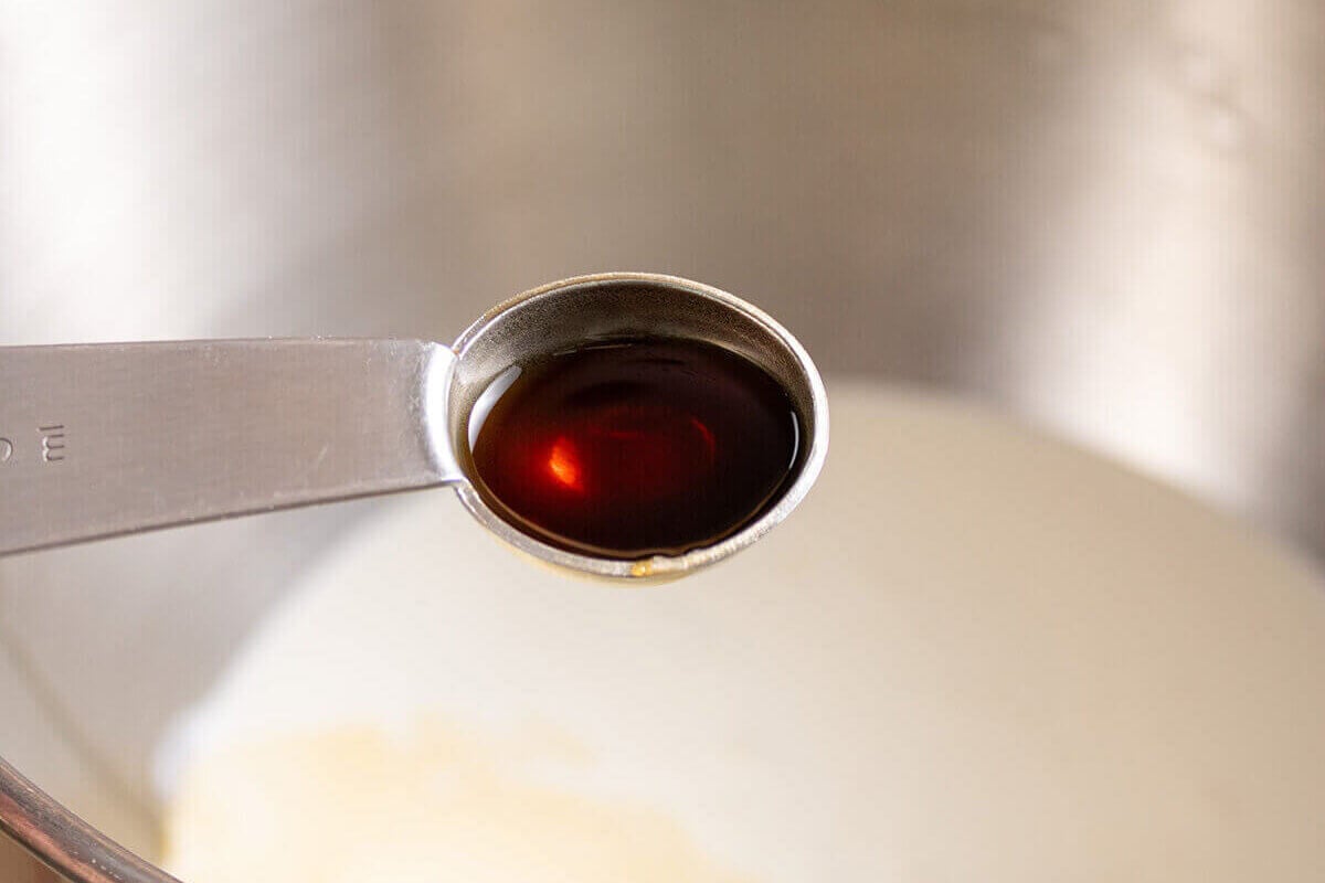 A teaspoon filled with vanilla.