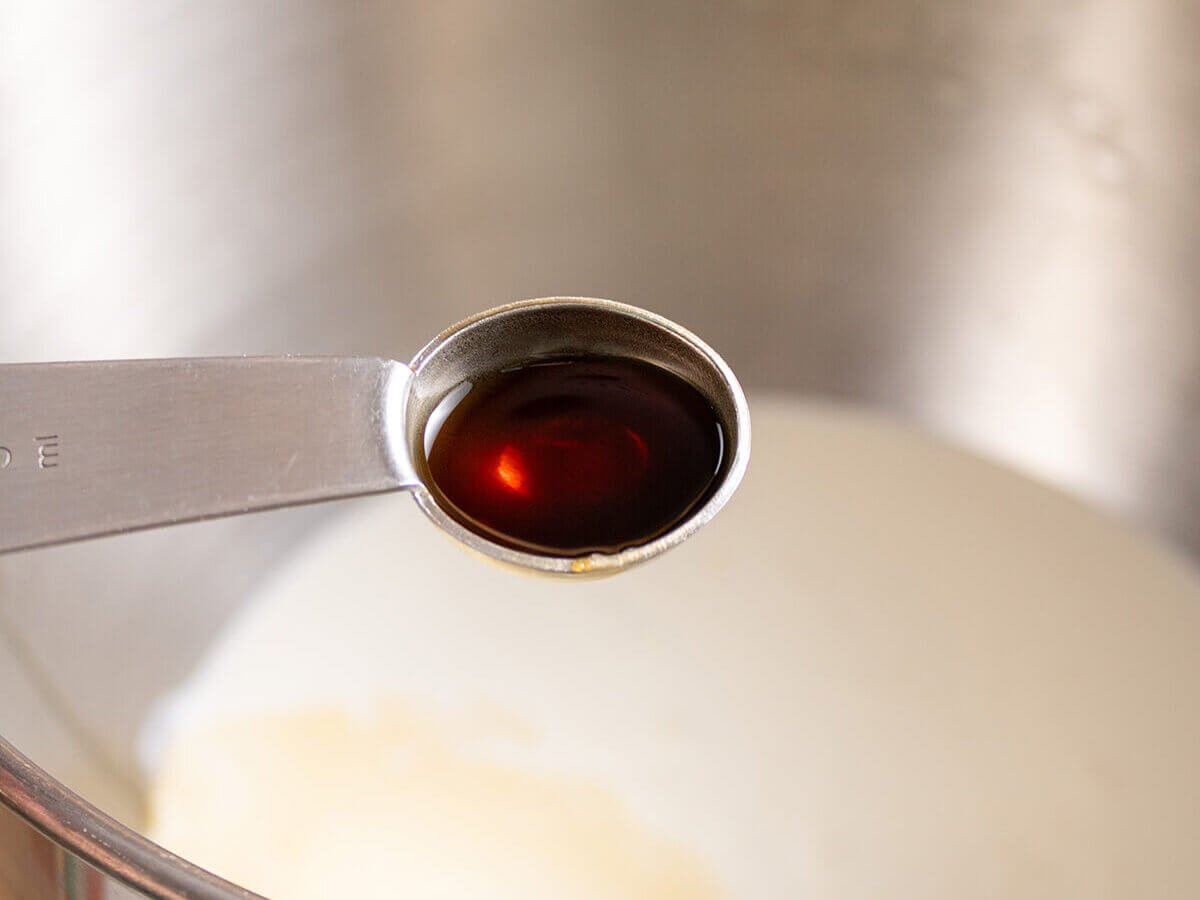 A teaspoon filled with vanilla.