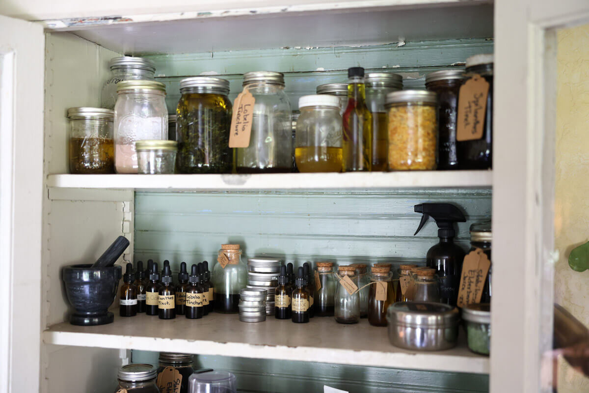 A cabinet full of medicinal herbal remedies.