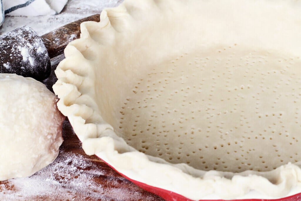 Pie crust in a pie pan.