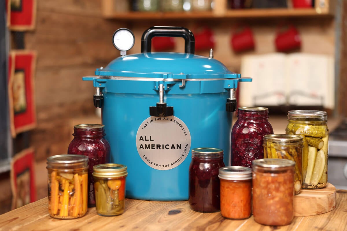 A counter full of pressure canned food.