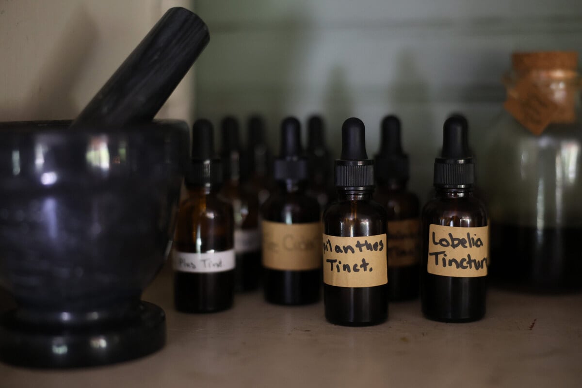 A shelf full of medicinal herbal remedies.