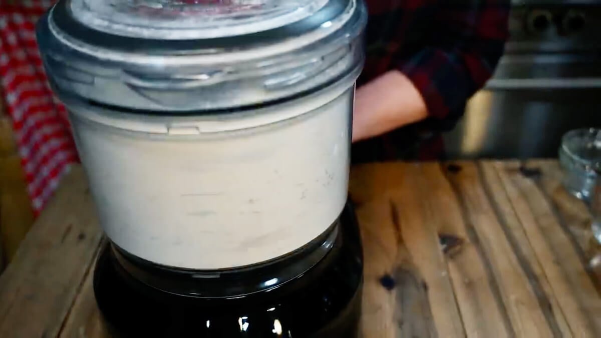Pie crust ingredients mixing in a food processor.