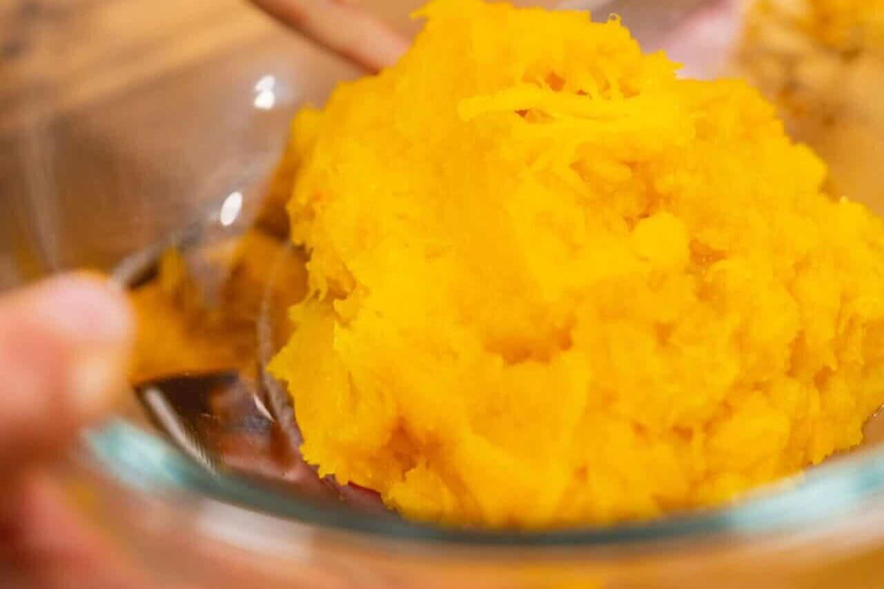 A glass bowl of homemade pumpkin puree.