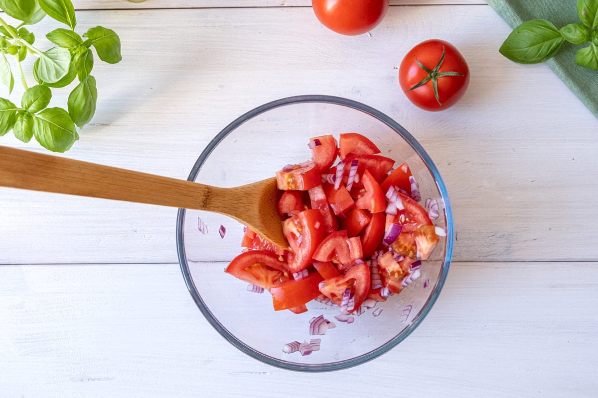 Diced tomatoes in a mixing bowl.