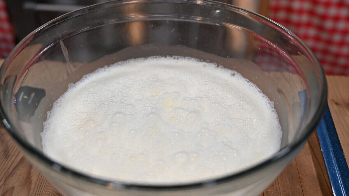 Fluffy eggnog in a glass bowl.
