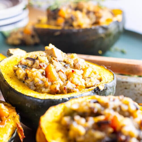 Stuffed acorn squash on a serving tray.