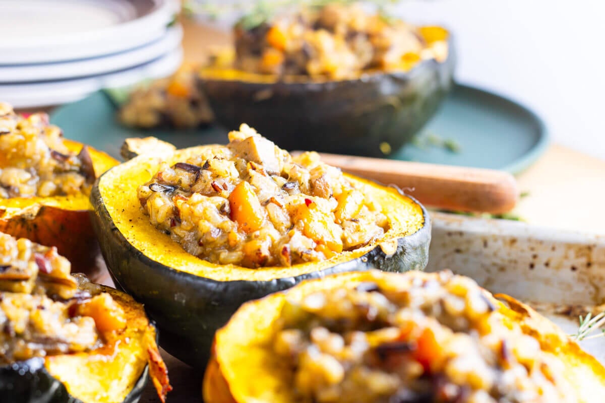 Stuffed acorn squash on a serving tray.