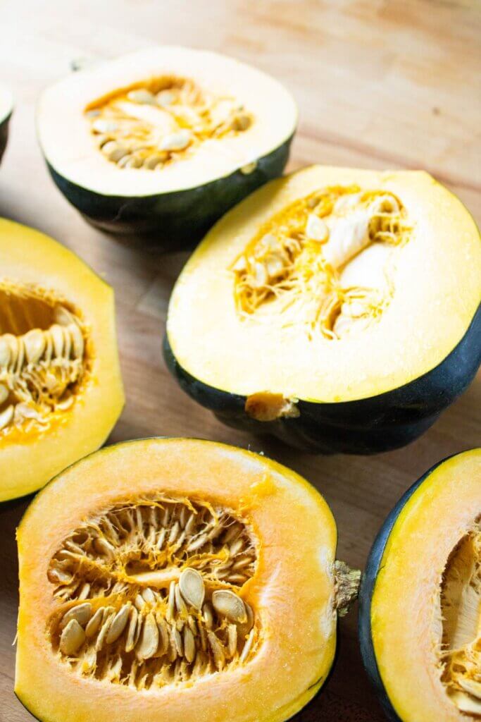 Fresh acorn squash sliced in half.