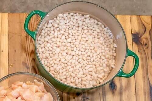 Ingredients for homemade chicken chili measured and in glass bowls.