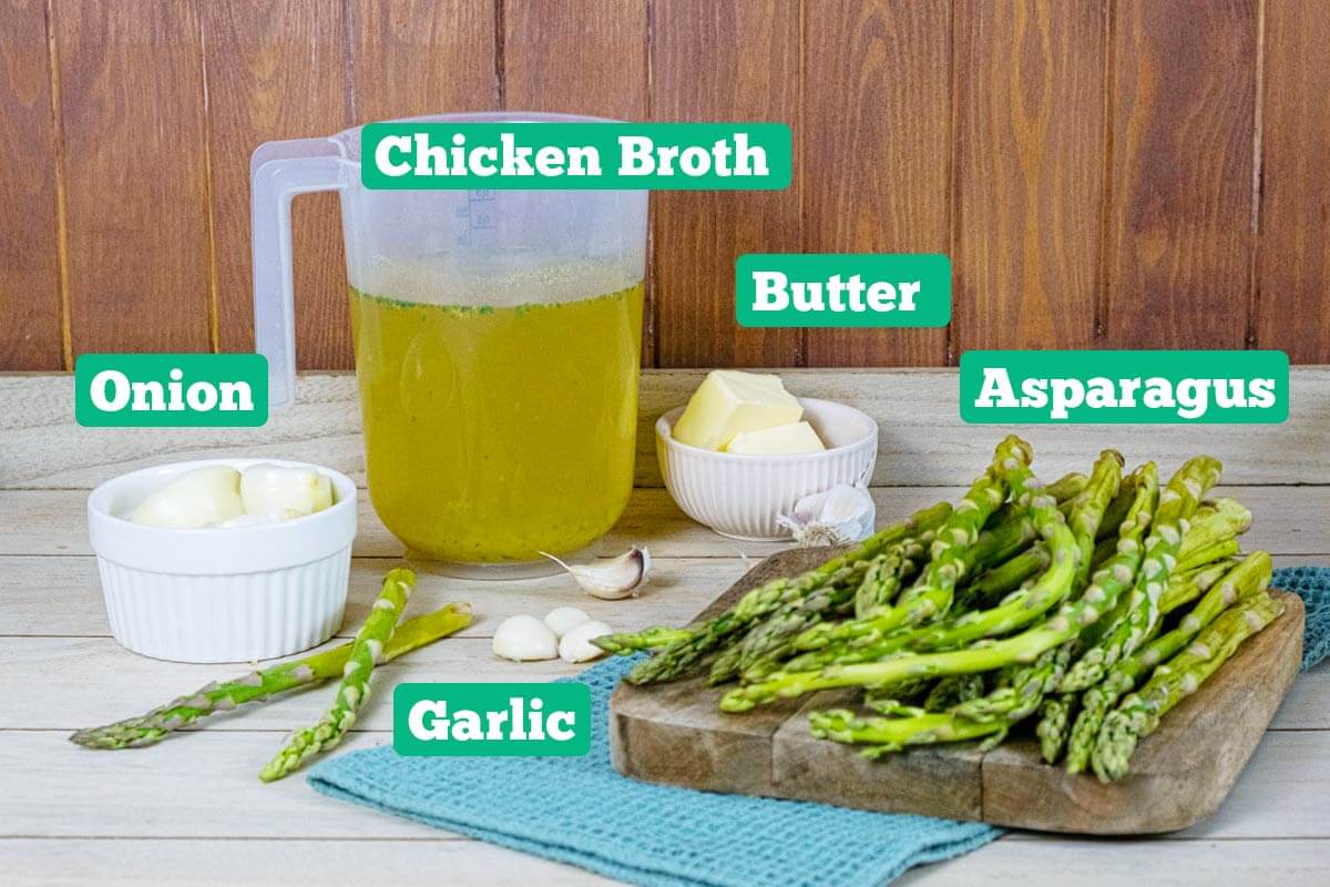 Asparagus soup ingredients: chicken broth, butter, asparagus, garlic, and onion.