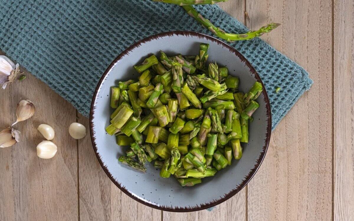 Chopped asparagus in a bowl.