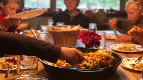 A family sitting down to a meal together.