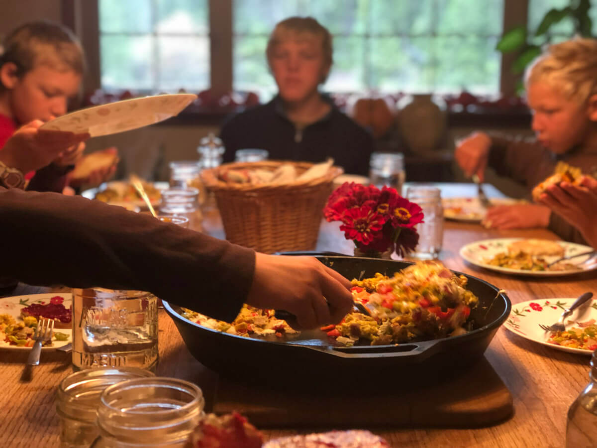 A family sitting down to a meal together.