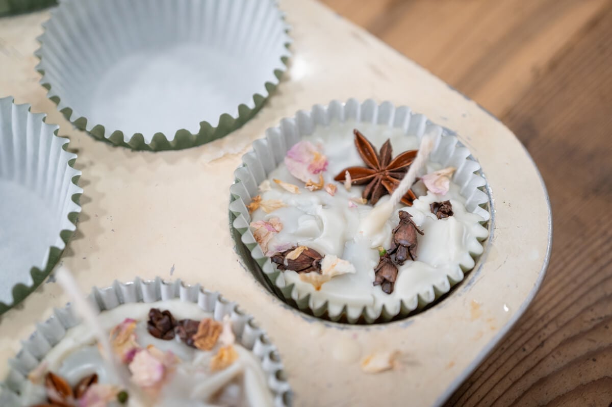 DIY firestarter hardening in a lined muffin tin.