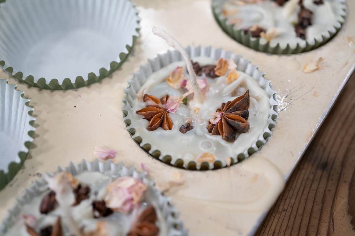 DIY firestarter hardening in a lined muffin tin.