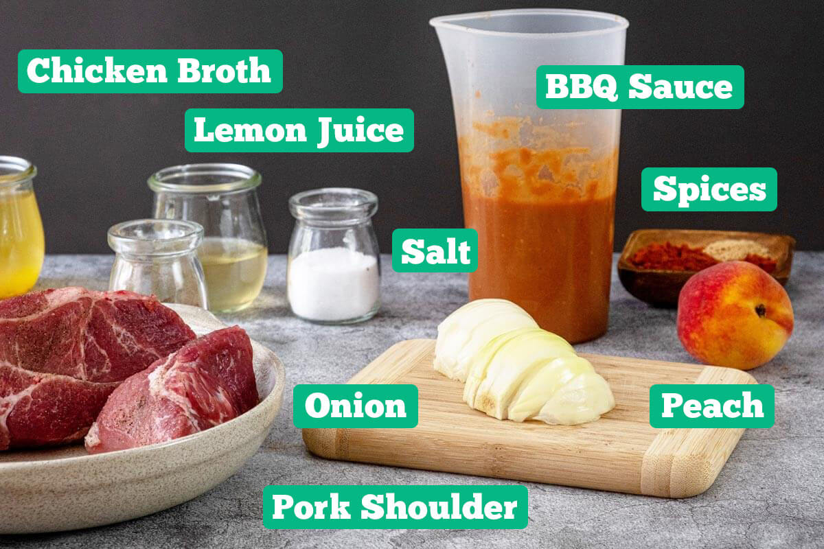 Slow cooker BBQ pork ingredients: pork shoulder, chicken broth, lemon juice, salt, onion, BBQ sauce, spices and peaches.