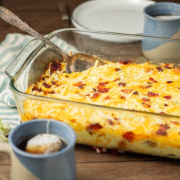 A baked Amish breakfast casserole in a glass baking dish.