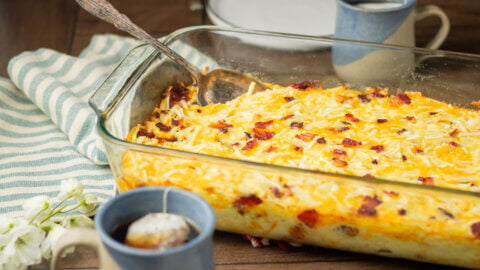 A baked Amish breakfast casserole in a glass baking dish.