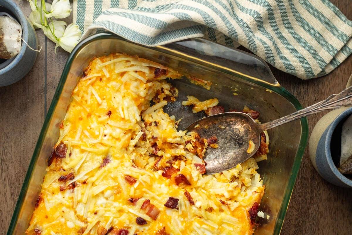 Bird's eye view of a baked Amish breakfast casserole in a glass baking dish.
