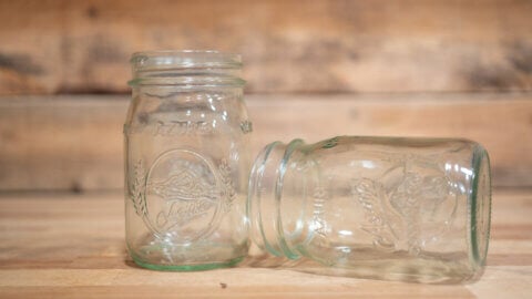 Canning jars on a wooden counter.