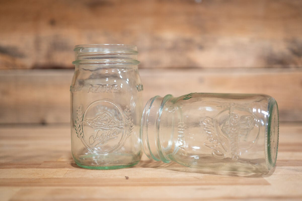 Canning jars on a wooden counter.