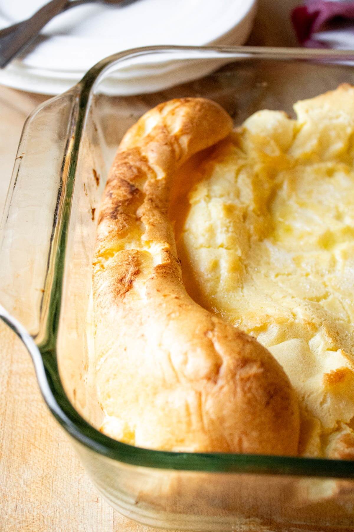 A German pancake in a baking dish fresh from the oven.