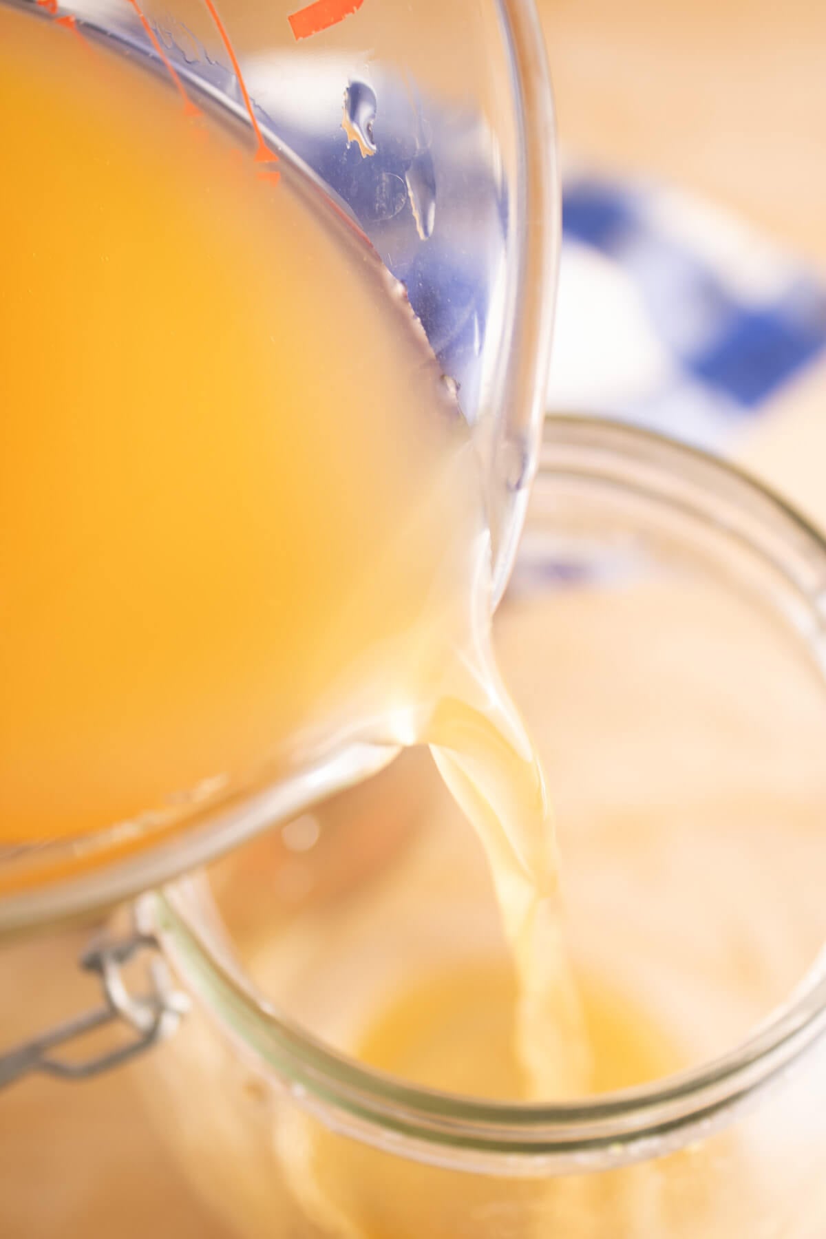 Vinegar being poured into a jar.