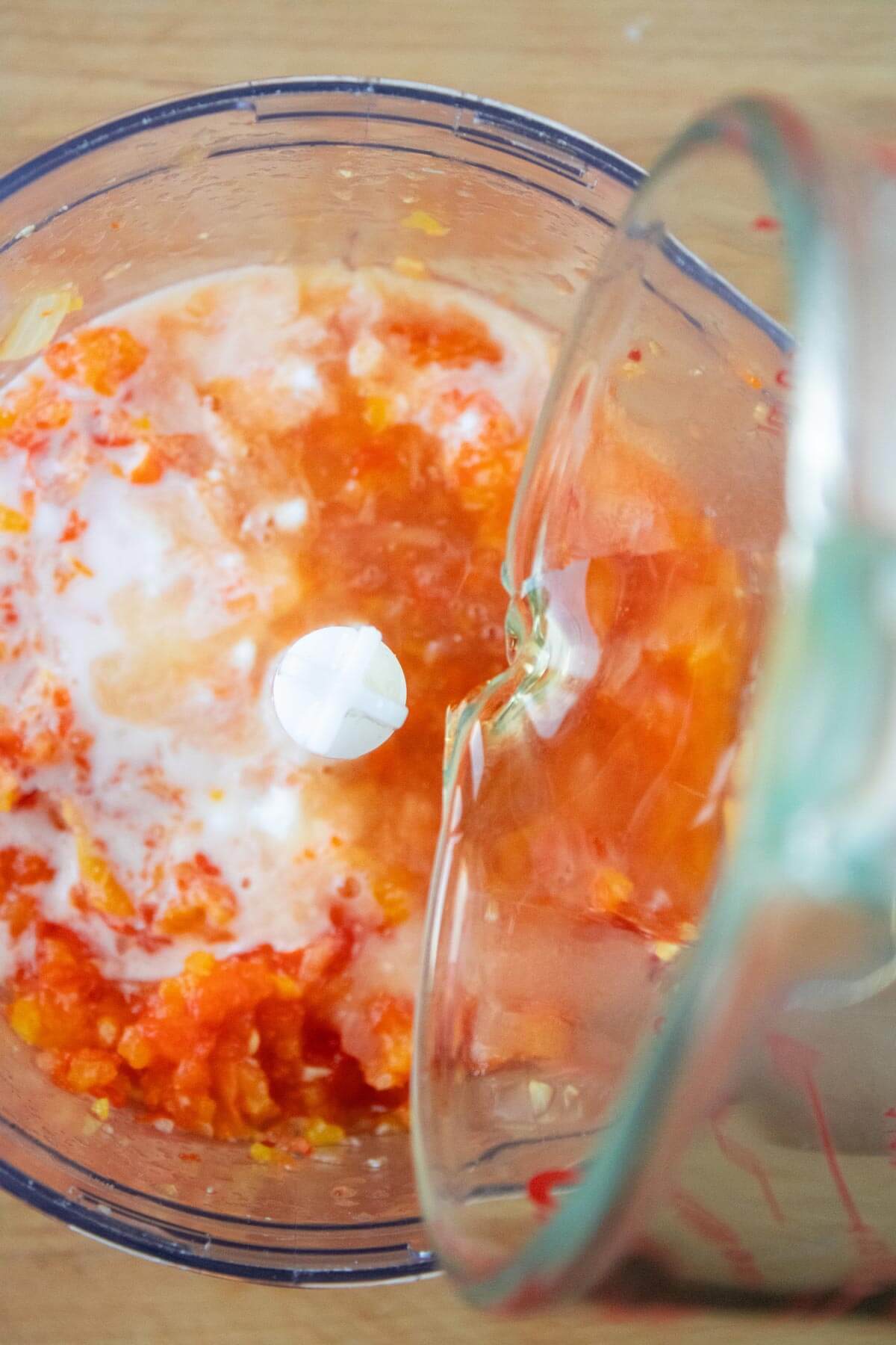 Fermented pepper sauce ingredients in a food-processor waiting to puree.