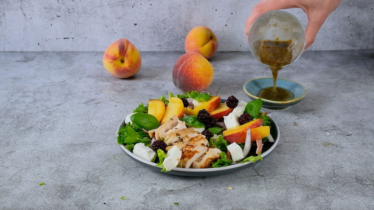 Plated peach salad with feta.