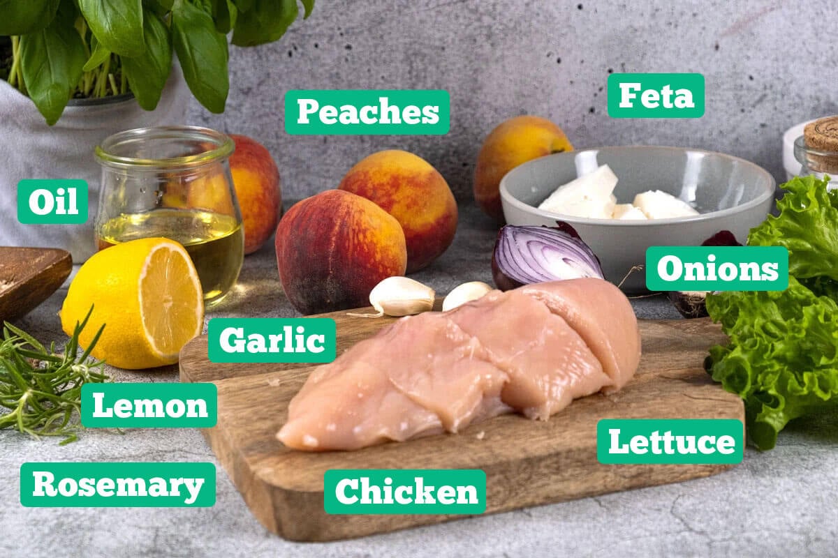 Peach salad with feta ingredients: chicken, peaches, feta, onions, lettuce, rosemary, lemon, and oil.