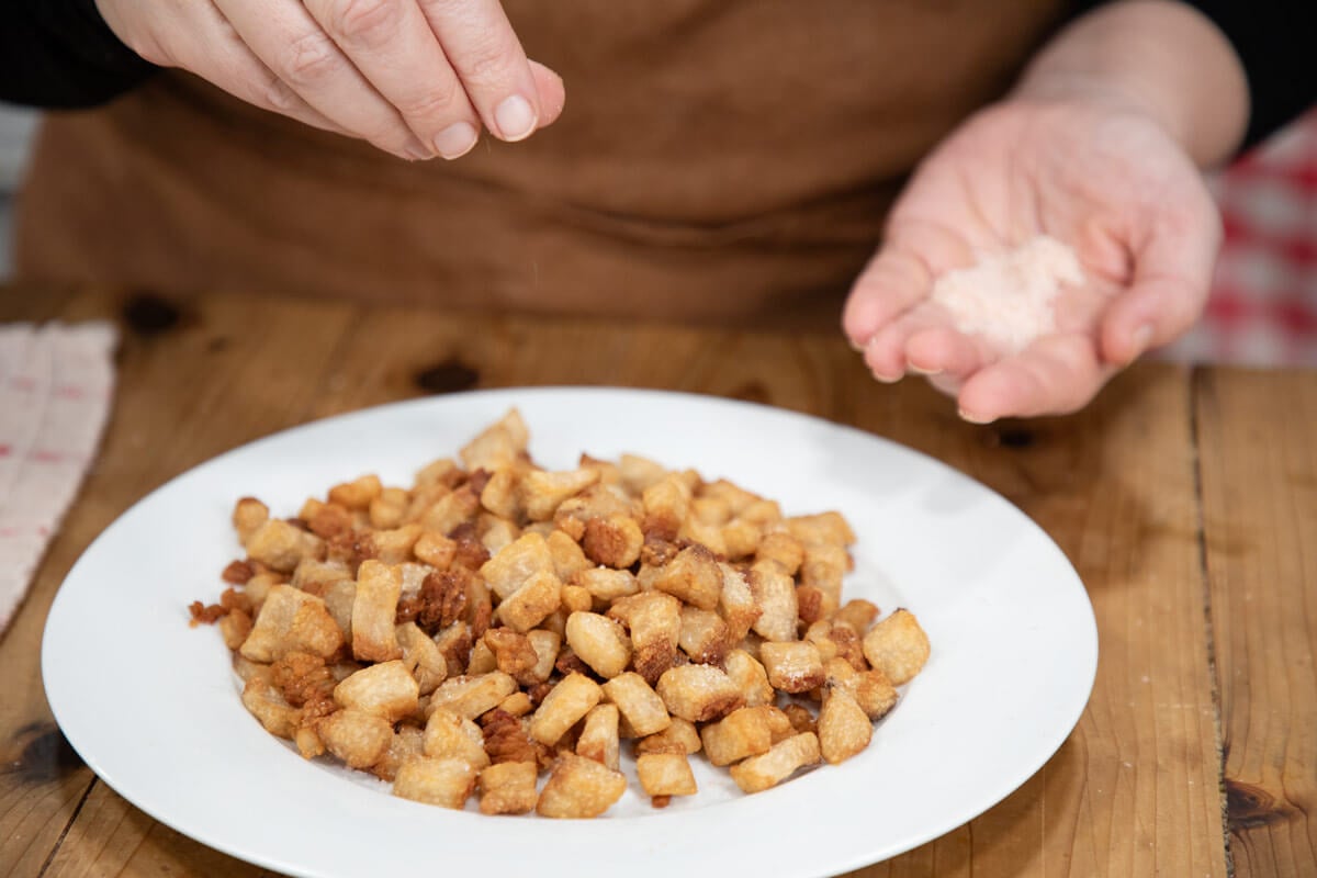 Fresh cracklings on a white plate.