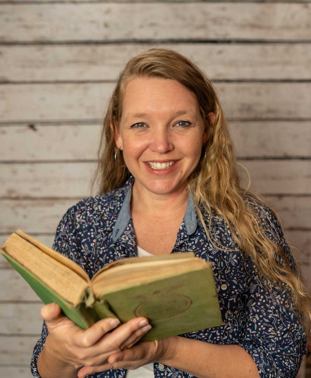A woman holding a book.