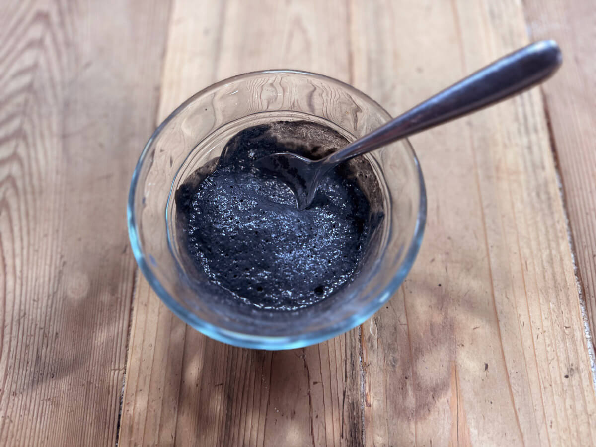 A clay mask mixed up in a bowl.