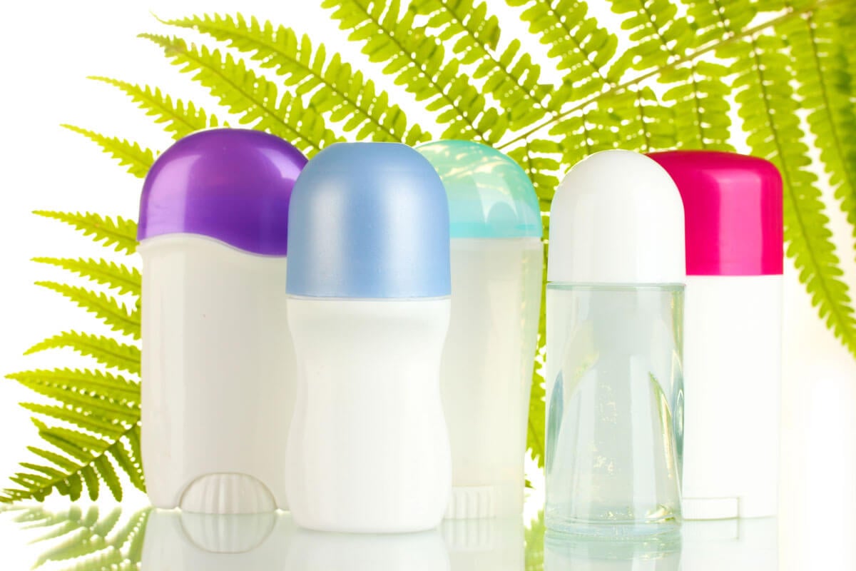 Deodorant bottles with colorful lids.