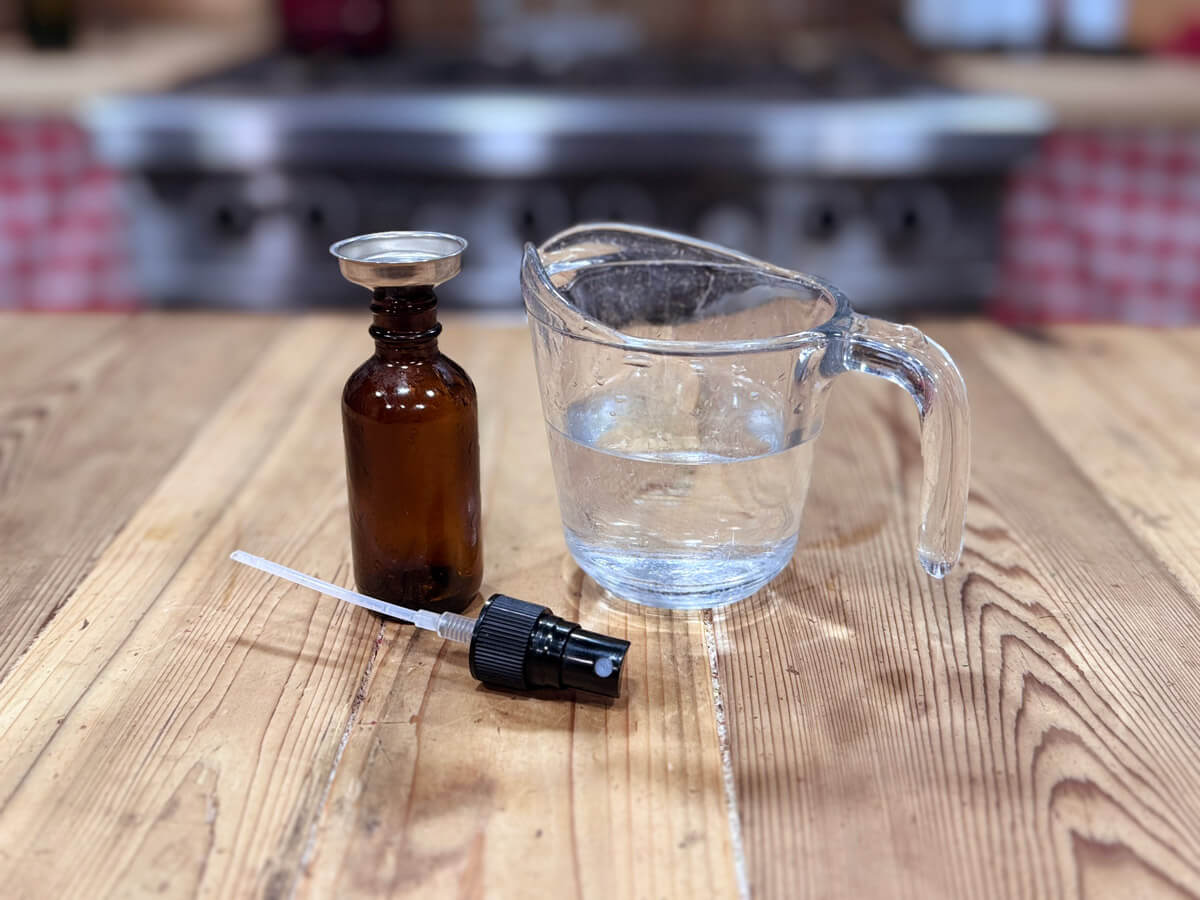 Magnesium deodorant spray and a spray bottle.