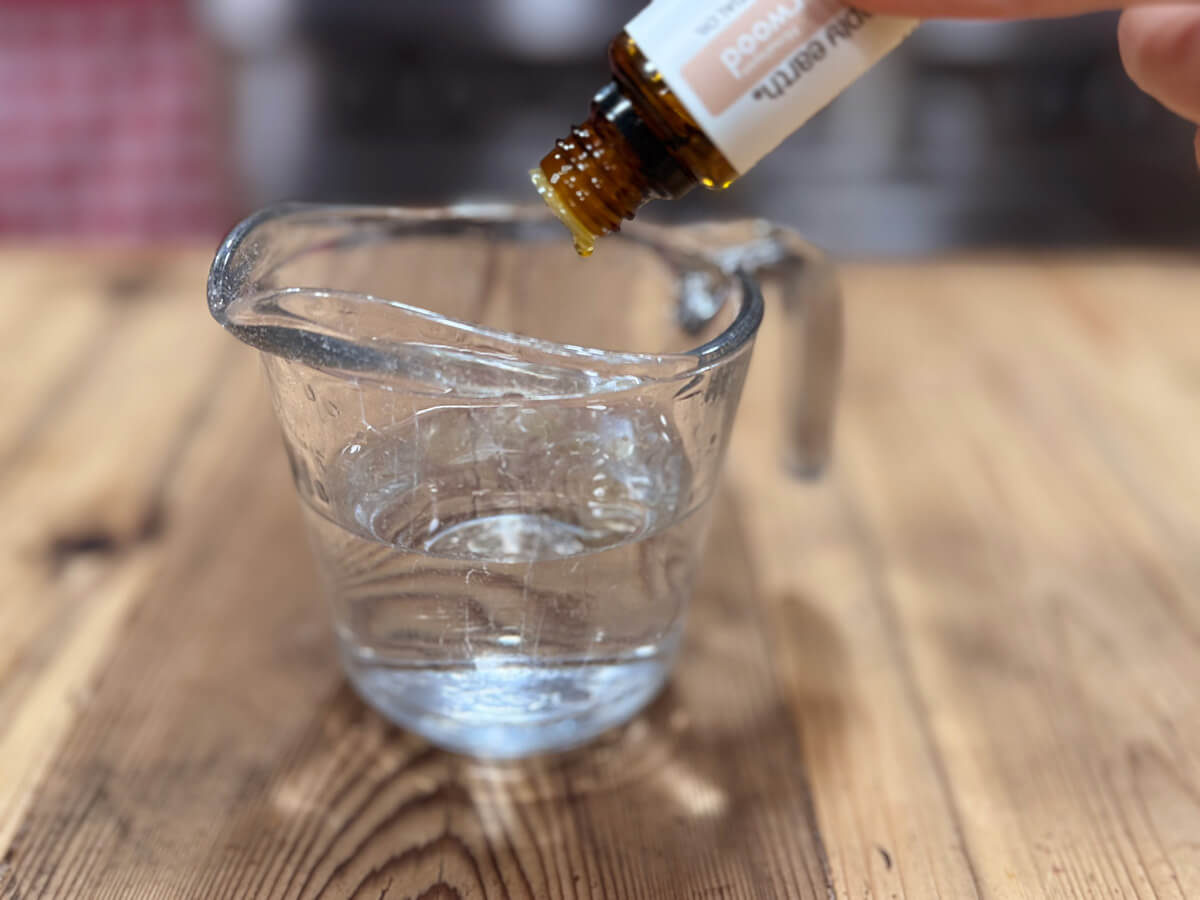 Adding essential oils to a deodorant spray.