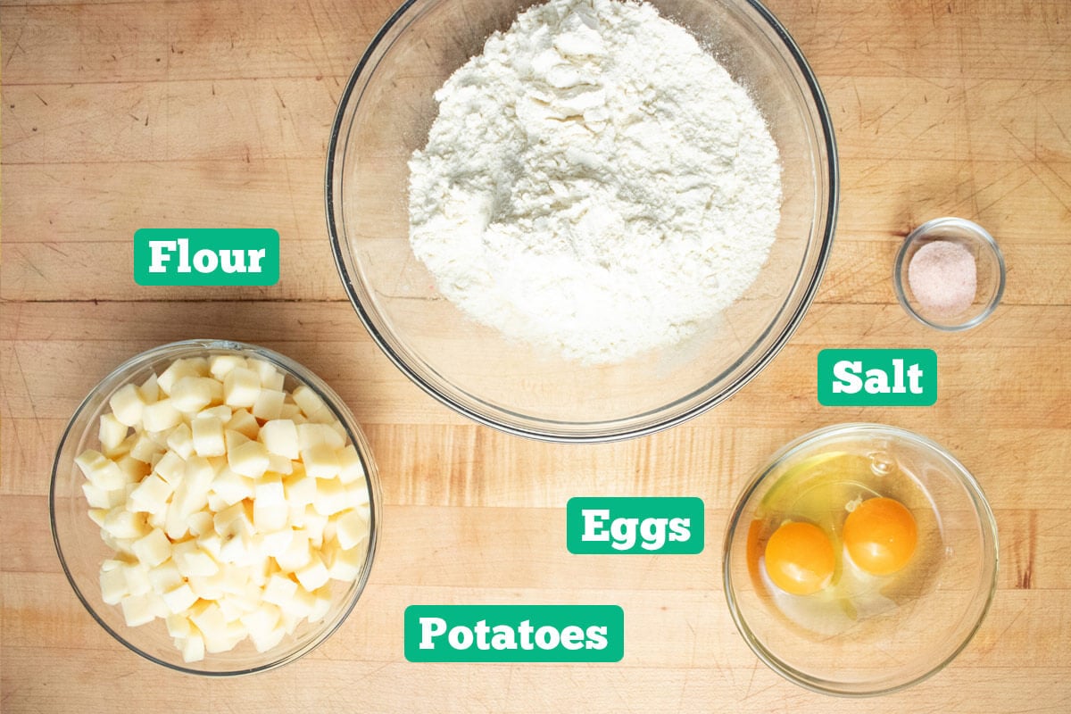 Homemade gnocchi recipe ingredients: flour, eggs, salt, and potatoes.