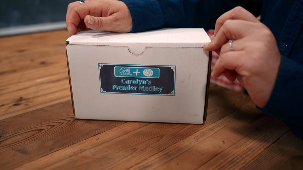 A box that says Carolyn's Mender Medley on it.