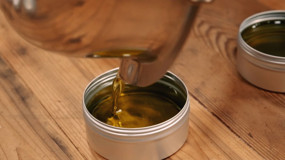 Salve being poured into a tin.