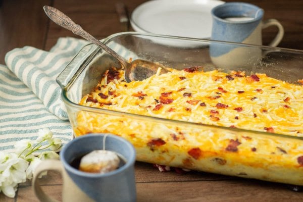 A baked Amish breakfast casserole in a glass baking dish.
