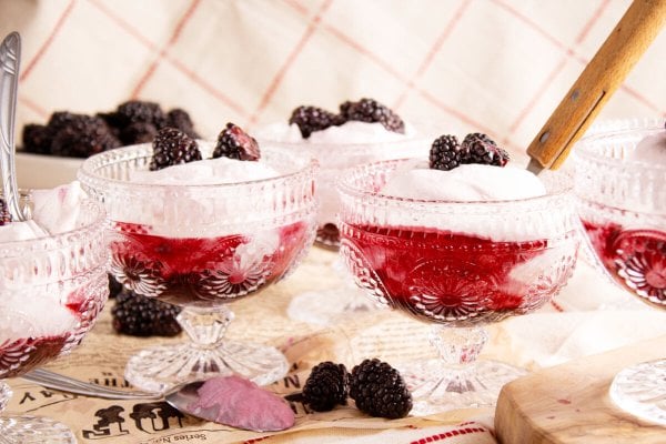 served in stemware and garnished with fresh blackberries.