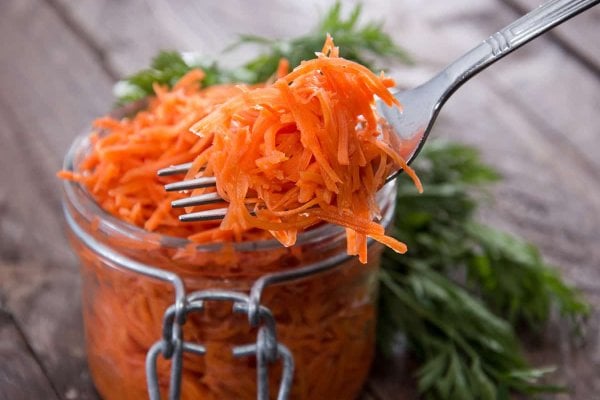 Fermented carrots on a fork.
