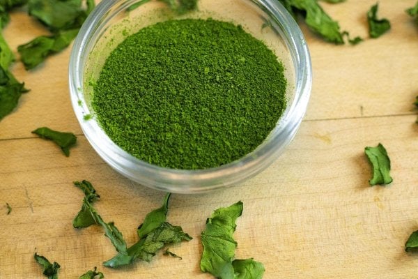 Freshly milled dried greens in a glass bowl.