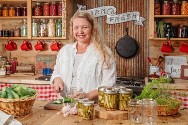 A woman canning pickles.