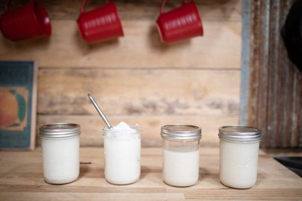 Rendered-Lard-Hero_HF Four jars of rendered lard sitting on a counter.