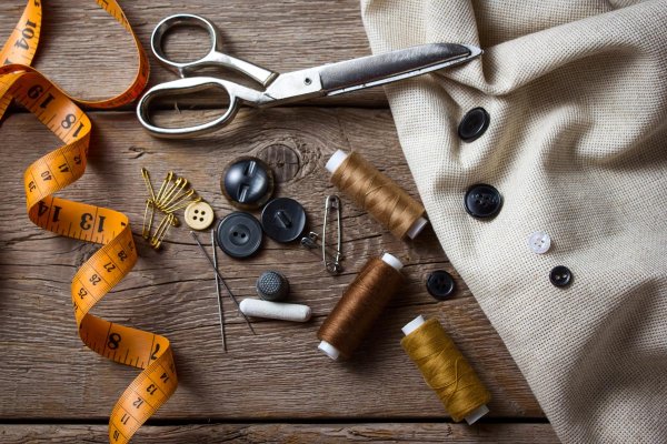Sewing-Supplies_HF Sewing supplies on a wooden table.